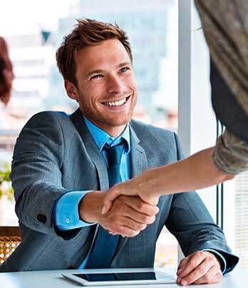 Man shaking woman's hand