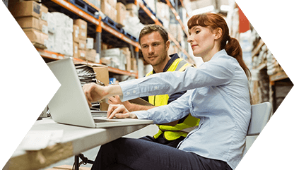 Warehouse workers using a computer